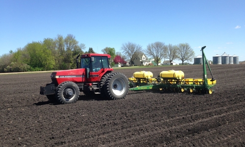 tractor planting in the field